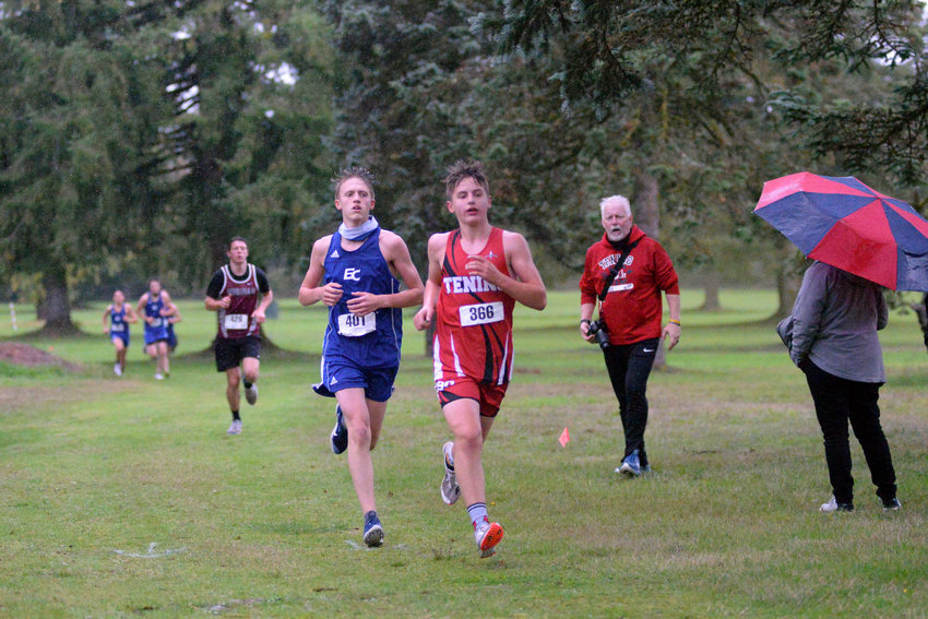 Tenino sophomore Carson Hart, right, leads Eatonville's Joe Mueller during the 1A Evergreen League cross country championship meet on Thursday at Oaksridge Golf Course in Elma.