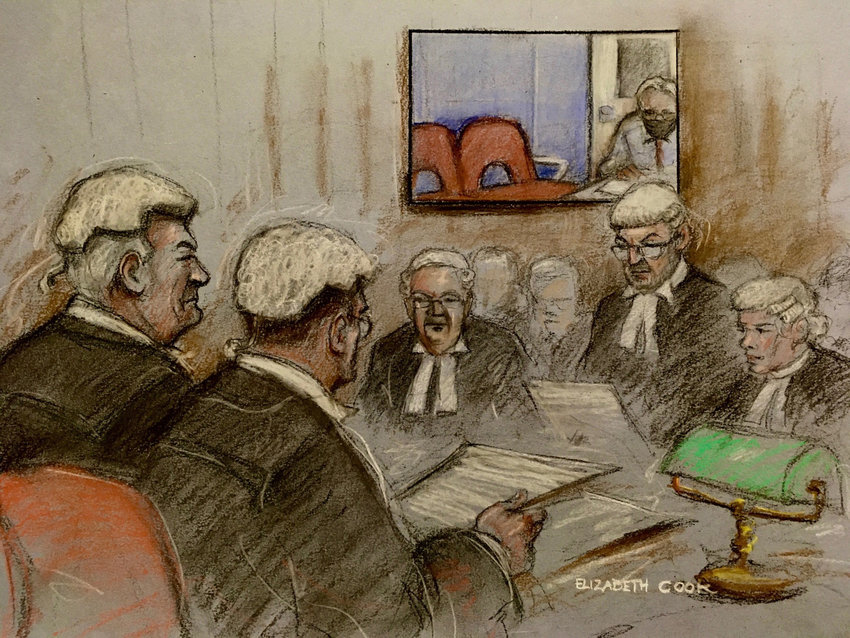 A court artist sketch by Elizabeth Cook of Julian Assange appearing via video, with Lord Chief Justice Lord Burnett, left, Lord Justice Holroyde, second left, and barrister James Lewis QC, second right standing, during a hearing at the High Court in London, ahead of the U.S. government's legal challenge over a judge's decision not to extradite the Wikileaks founder, Wednesday, Oct. 27, 2021. (Elizabeth Cook/PA Wire/Abaca Press/TNS)