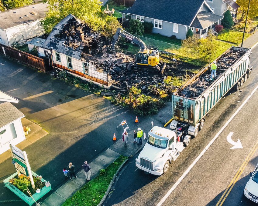 Crews work Friday on Main Street in Centralia to safely cleanup debris following a structure fire that occurred in September 2020.