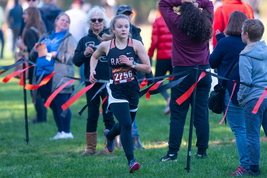 FILE PHOTO -- Rainier senior Selena Niemi heads toward the finish line at the 2B District 4 girls cross country championships on last week in Rainier. Niemi finished fourth to help the Mountaineers place second as a team.