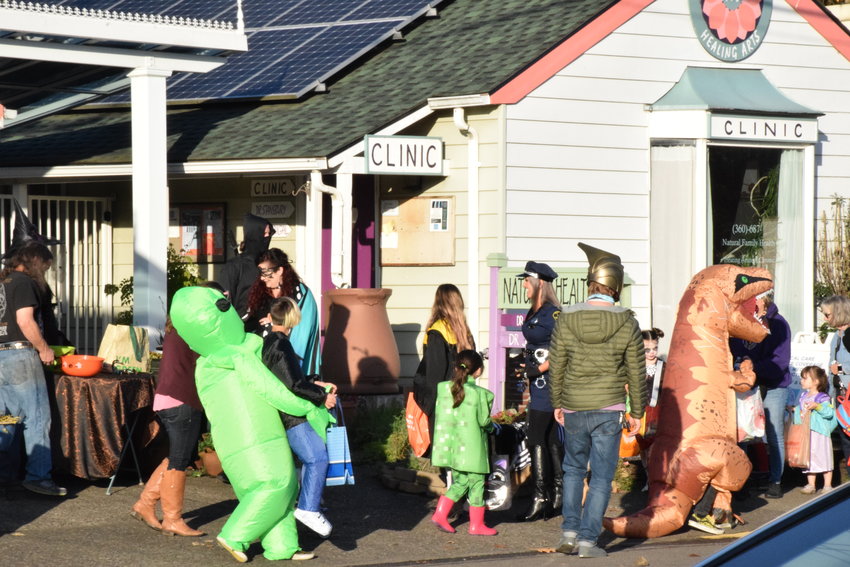 Trick-or-treaters saunter along Battle Ground&rsquo;s Main Street during the city&rsquo;s annual Halloween event on Oct. 29.