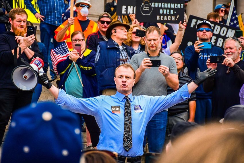 Tim Eyman speaks at a protest at the Capitol in April 2020.