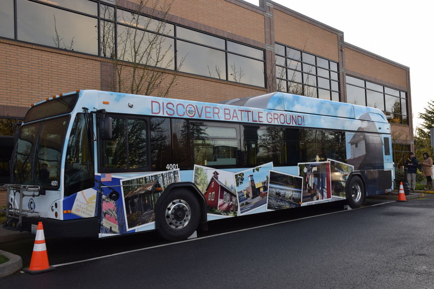 A C-Tran bus decked out in images of Battle Ground sits at city hall in 2019.
