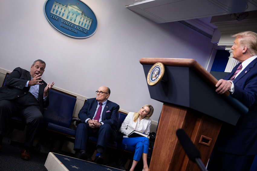 Former New York City Mayor Rudy Giuliani, White House Press Secretary Kayleigh McEnany and US President Donald Trump listen while former New Jersey Governor Chris Christie speaks during a briefing at the White House Sept. 27, 2020, in Washington, DC. (Brendan Smialowski/AFP via Getty Images/TNS)