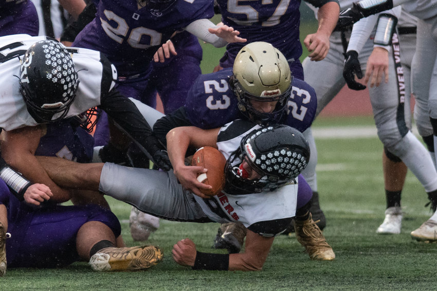Onalaska linebacker Kole Taylor brings down a River View ballcarrier in the opening round of the 2B state tournament Nov. 13 at Centralia Tigers Stadium.