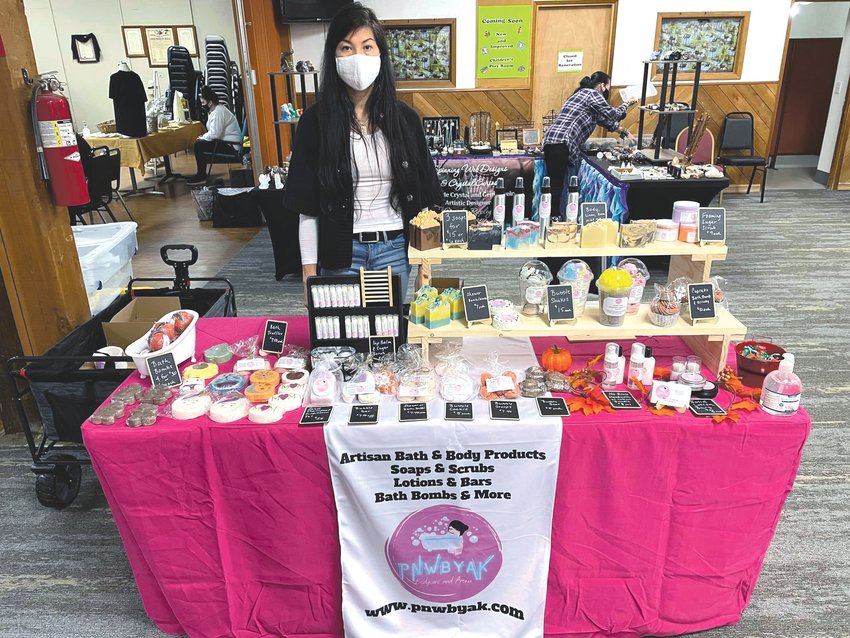 A vendor with Pop Up Vendors Galore sets up shop at the Nisqually Moose Lodge at a recent vendor fair hosted by the organization.