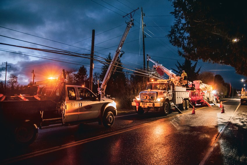 Centralia Lights Department and other crews work to repair a power pole in the 1500 block of North Pearl Street in Centralia last November.