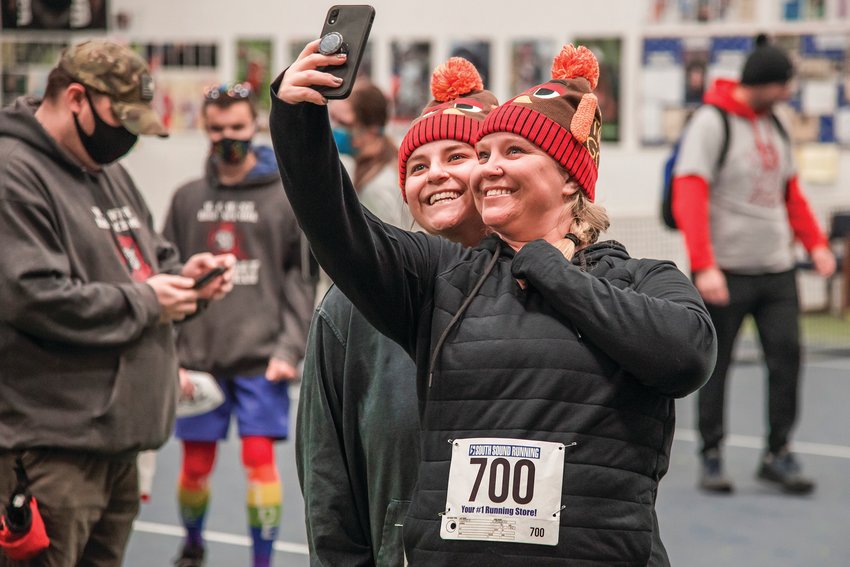 Anahbelle and Alyssa Lopez smile and pose for a selfie while sporting matching beanies during a Turkey Trot 5K hosted by Althauser Rayan Abbarno, LLP at the Chehalis Thorbeckes Thursday morning on Thanksgiving Day. The Centralia law firm has been hosting the event for about five or six years now, Peter Abbarno told The Chronicle this week, though the event was hosted virtually in 2020. Proceeds will go to the Chehalis Foundation and the Boys and Girls Club of Lewis County.