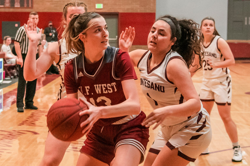 W.F. West&rsquo;s Drea Brumfield (13) looks to pass while surrounded by Bulldog defenders in Montesano Tuesday night.