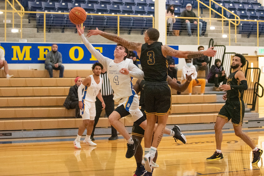 Centralia College guard Kayden Kelly (4) drives to the bucket against Portland during the Trailblazers' home opener on Dec. 1.