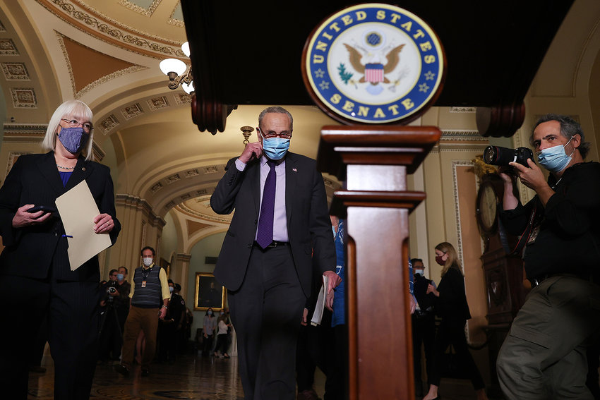 Senate Majority Leader Charles Schumer (D-NY) (center) and Sen. Patty Murray (D-WA) (left) arrive for a news conference following the weekly Democratic policy luncheon at the U.S. Capitol on Nov. 30, 2021, in Washington, DC. (Chip Somodevilla/Getty Images/TNS)