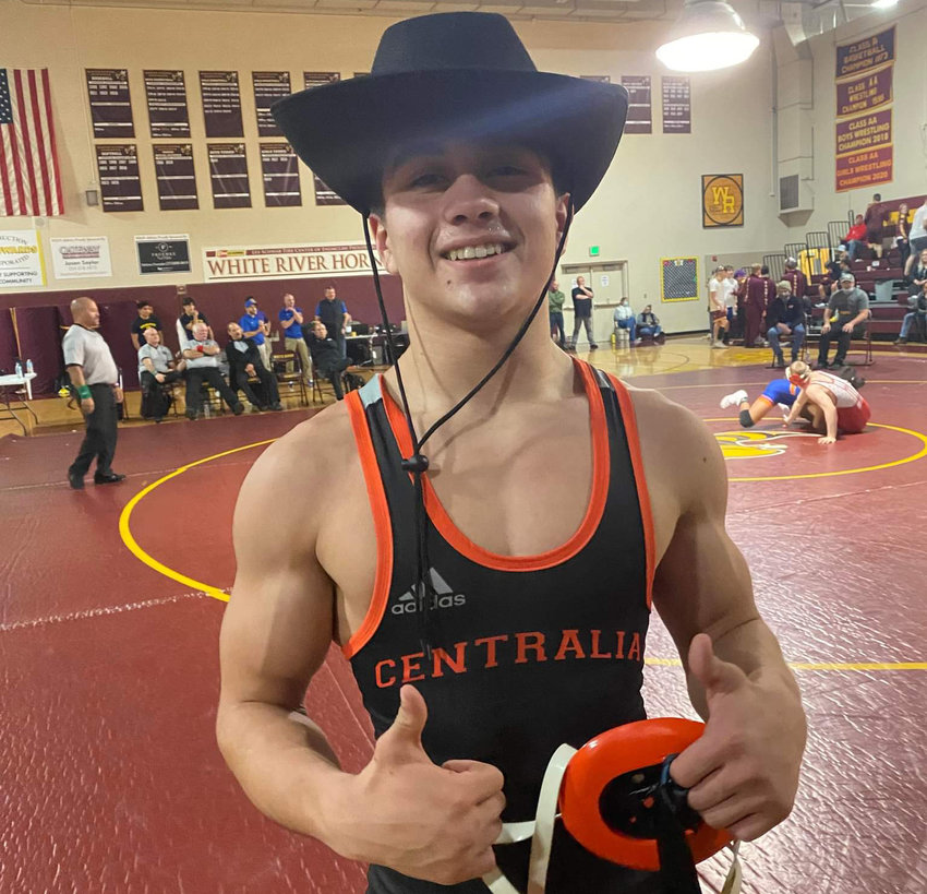 Centralia sophomore Antonio Campos poses with a cowboy hat he won as part of capturing the 120-pound boys title at the White River Classic on Dec. 4.