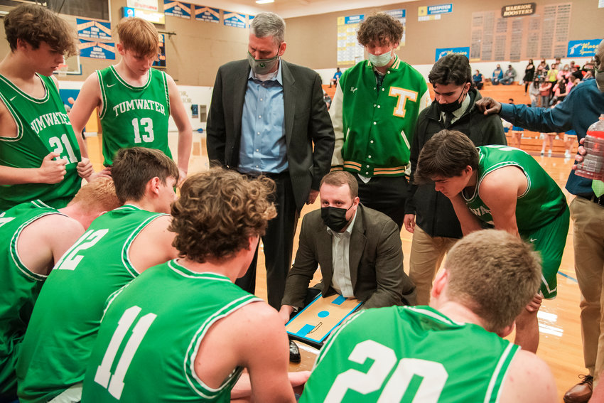 FILE PHOTO -- Tumwater Head Coach Josh Wilson talks to athletes during a game Wednesday night in Rochester.