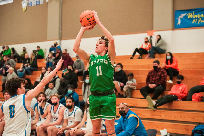 Tumwater&rsquo;s Luke Brewer (11) puts up a shot Wednesday night during a game in Rochester.