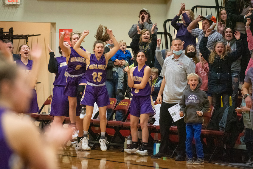 Onalaska players leap in celebration after Winlock's final shot falls short in a 41-39 victory over the Cardinals in Winlock on Friday.