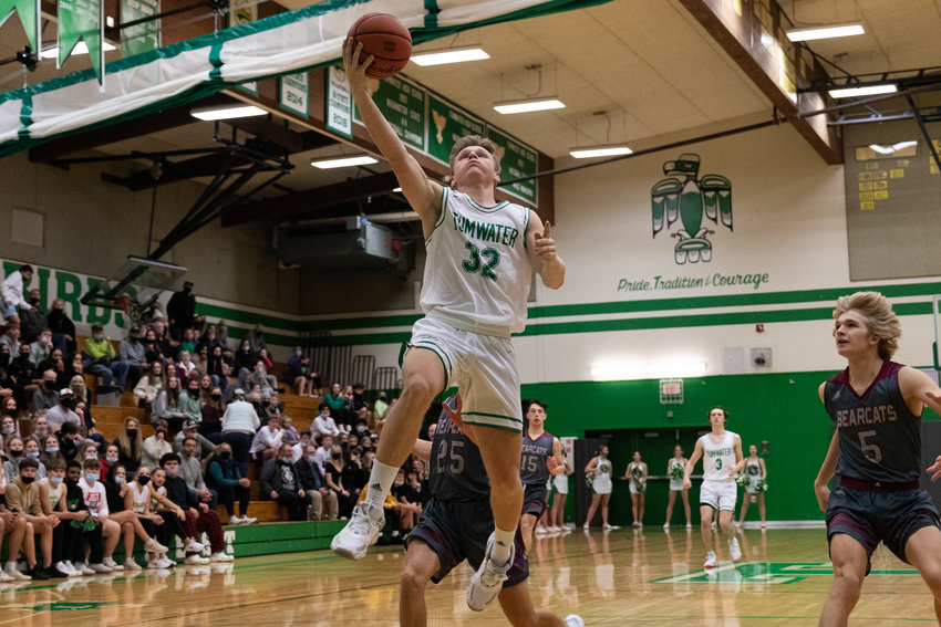 Tumwater forward Adam Overbay drives to the rim against W.F. West Dec. 16.