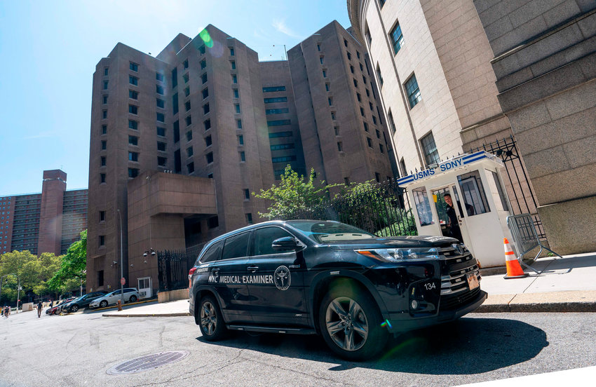 A New York Medical Examiner's car is parked outside the Metropolitan Correctional Center where financier Jeffrey Epstein was being held, on Aug. 10, 2019, in New York. (Don Emmert/AFP/Getty Images/TNS)