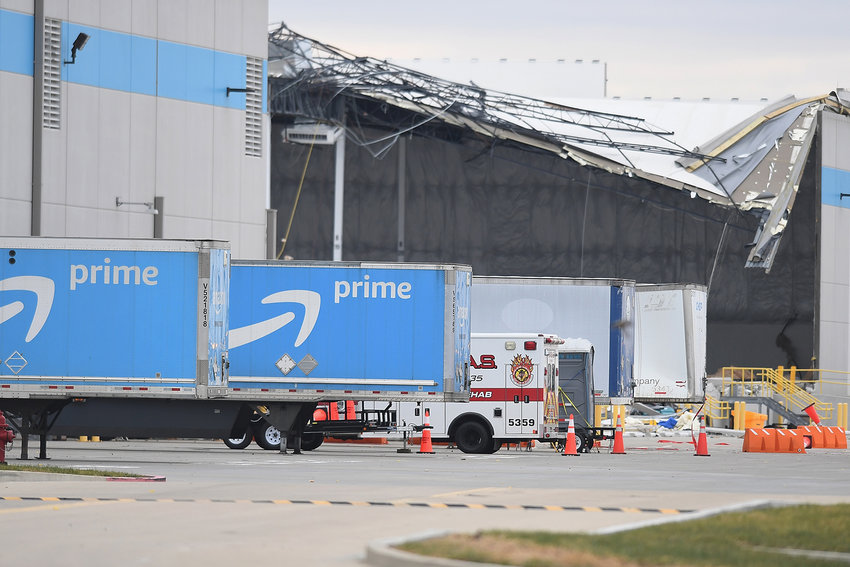 Amazon truck cabs are seen outside a damaged Amazon Distribution Center on Dec. 11, 2021, in Edwardsville, Illinois. According to reports, the Distribution Center was struck by a tornado Friday night. Emergency vehicles arrived to start rescue operations for workers believed to be trapped inside. (Michael B. Thomas/Getty Images/TNS)