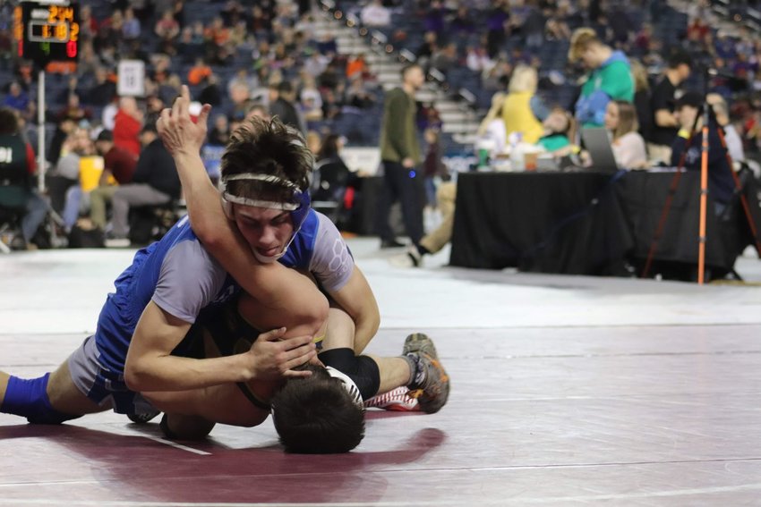 La Center senior Hunter Mallicoat presses his advantage against sixth-ranked Logan Patrick from Naches Valley at Mat Classic in 2020.