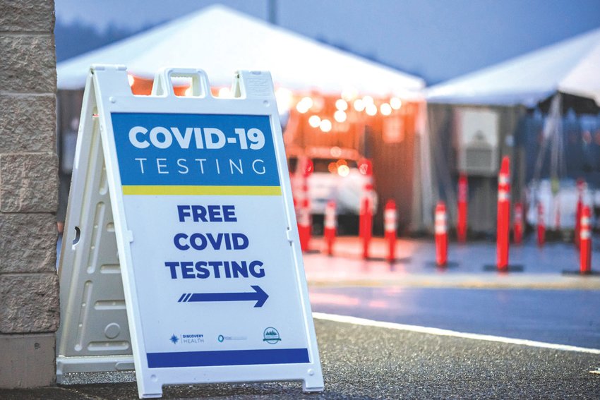 Signage for free COVID testing is pictured in this file photo.