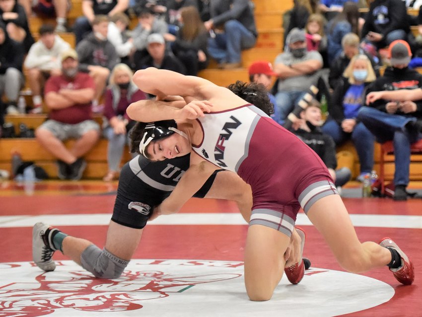 W.F. West&rsquo;s Ty Foister flips positions with a Union wrestler on Saturday, Jan. 8, at Castle Rock High School.