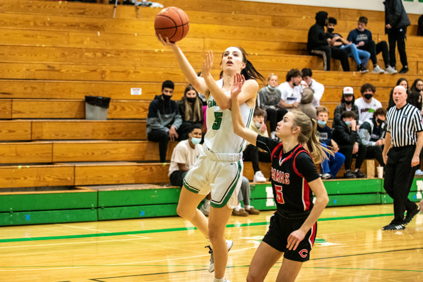 Tumwater's Natalie Sumrok, left, drives against Camas' Parker Mairs during a home game on Jan. 10.