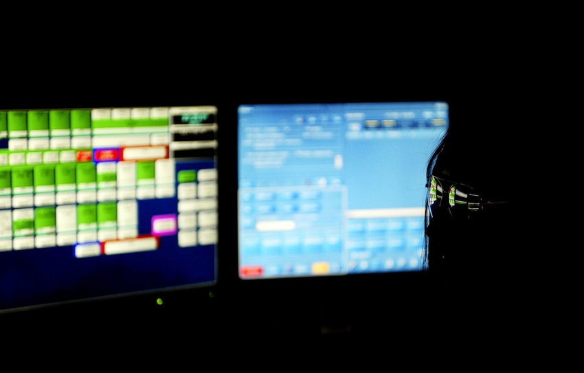 In this Sept. 11, 2012, file photo, sunglasses reflect the computer screens in front of a Lewis County 911 Communications Center dispatcher as she takes a call during a Friday night shift.
