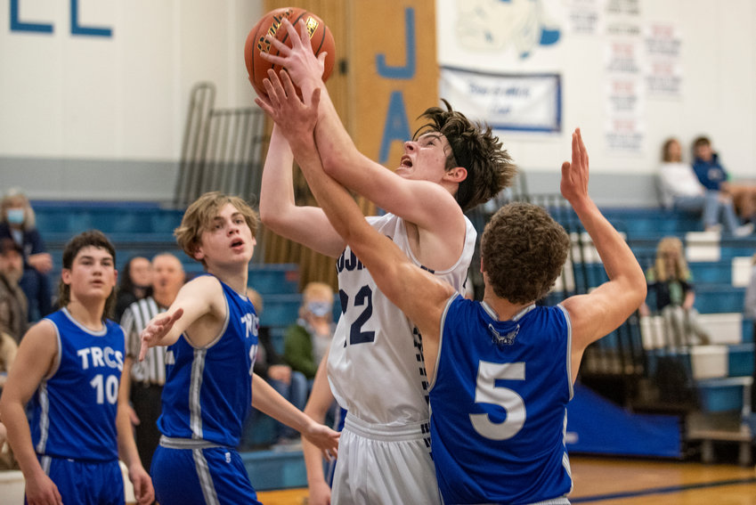 Pe Ell's Carter Phelps (22) drives for a layup during a home game against Three Rivers Christian on Jan. 13.