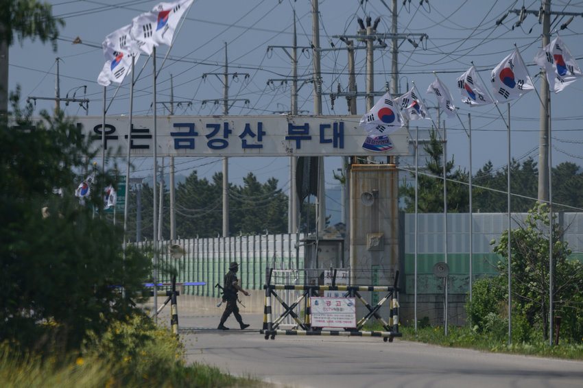 In this photo from June 17, 2020, a South Korean soldier guards the entrance to the camp Kumgang Mountain military base near the border area of Goseong on South Korea's northeast coast. (ED JONES/AFP via Getty Images/TNS)