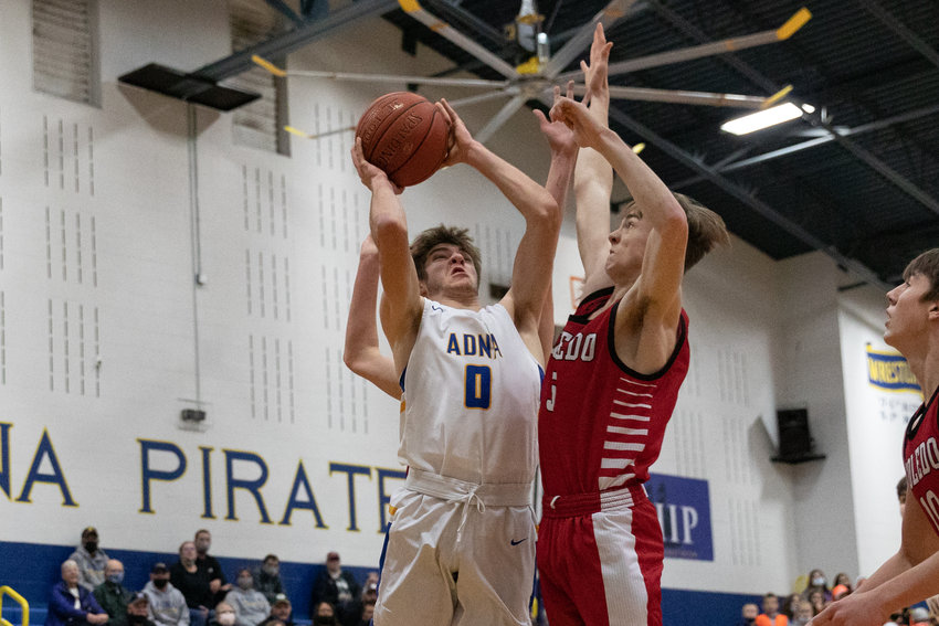 Adna guard Aaron Aselton drives for a layup against Toledo Jan. 21.