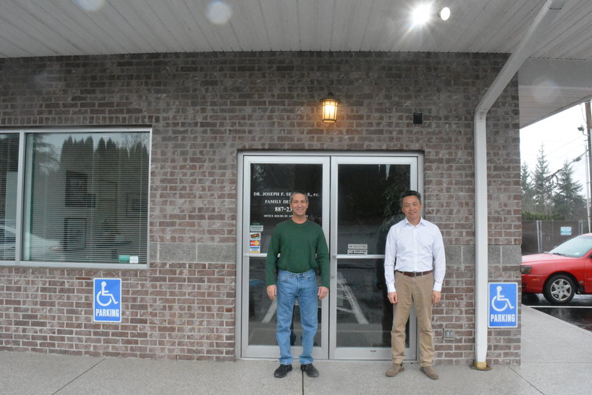 Dr. Joe Sepe, left, and Dr. Phat Ly, right, are pictured in front of Dimples Family Dentistry in Ridgefield.