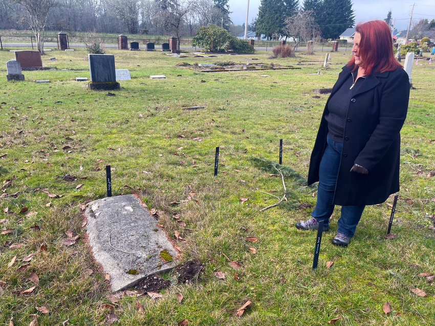 Debi Overlie, clerk and boardmember of Tenino's Forest Grove Cemetery, displays the unmarked children's graves that she was able to get recent donations for placards to commemorate the forgotten youths.