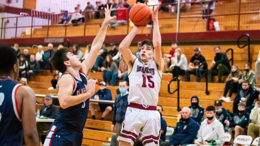W.F. West&rsquo;s Seth Hoff (15) looks to shoot over defenders Thursday night during a game.