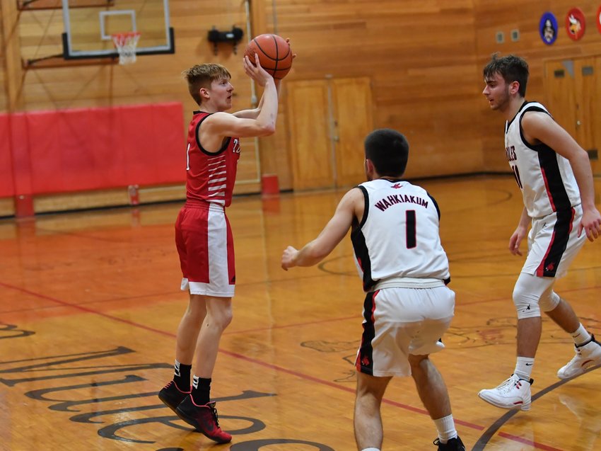 Toledo junior point guard Jake Cournyer takes a deep 3-pointer during a road game at Wahkiakum Jan. 31.