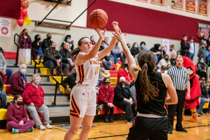 Winlock&rsquo;s Madison Vigre (10) scores over a Rainier defender during a game Wednesday night.