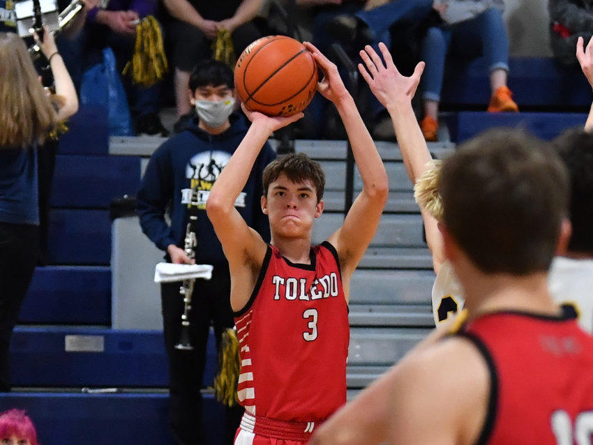 Toledo's Rogan Stanley (3) lines up a jumper against Ilwaco in the opening round of district Saturday in Ilwaco.