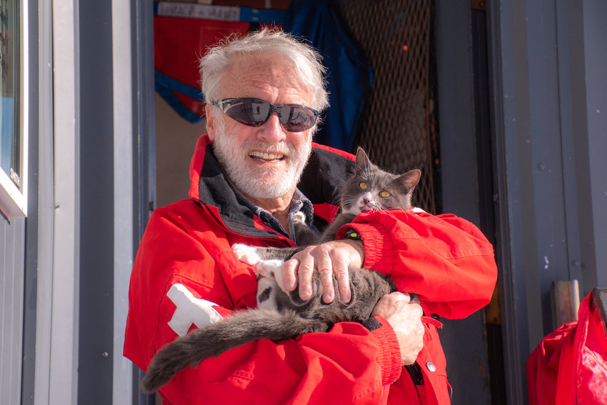 Michael Murphy, known on the slopes as &ldquo;Murph&rdquo; and his avalanche cat Uzi pose for a photo outside patrol dispatch at the top of the Great White Express chairlift on Sunday at the White Pass Ski Resort.