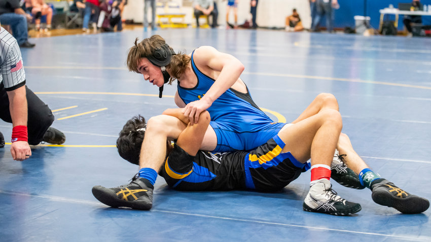 Adna&rsquo;s Kooper Moon looks to pin his opponent during a wrestling match Saturday afternoon.