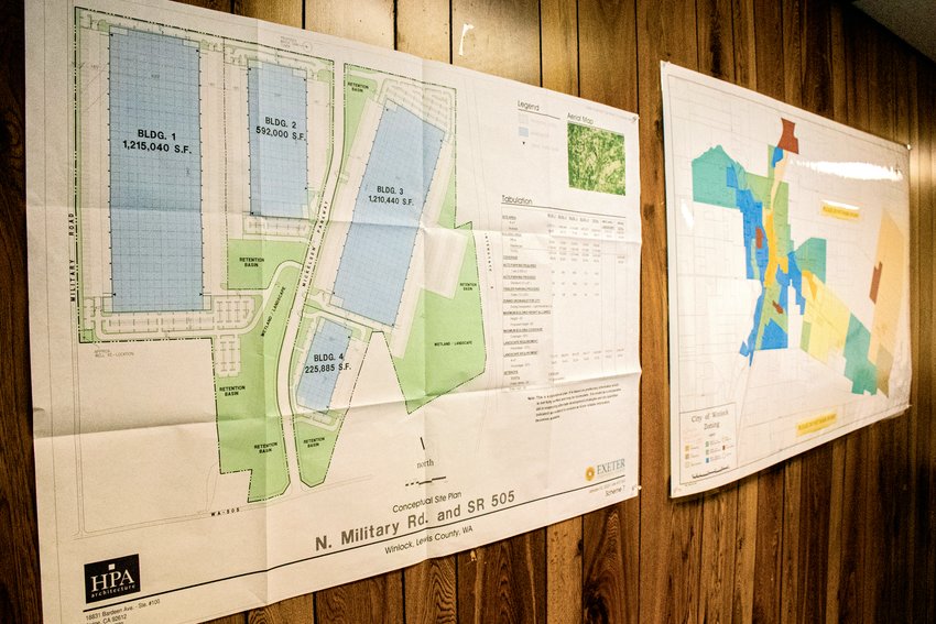 Maps of Mickelsen Parkway hang on a wall inside the Winlock City Office last February.