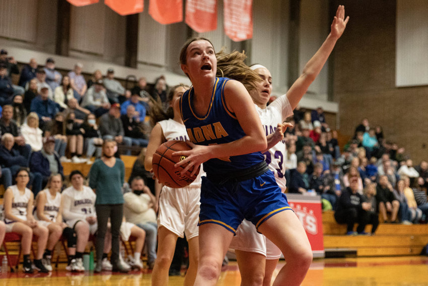 Adna guard Brooklyn Loose drives for a layup against Onalaska in the 2B District IV playoffs at Castle Rock Feb. 17.