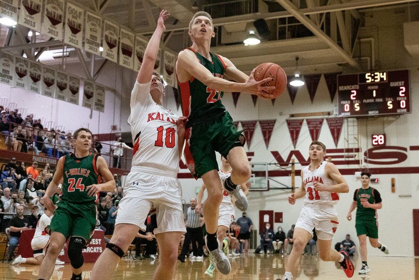 MWP forward Gary Dotson drives for a layup against Kalama in the 2B District IV Championship at W.F. West Feb. 19.