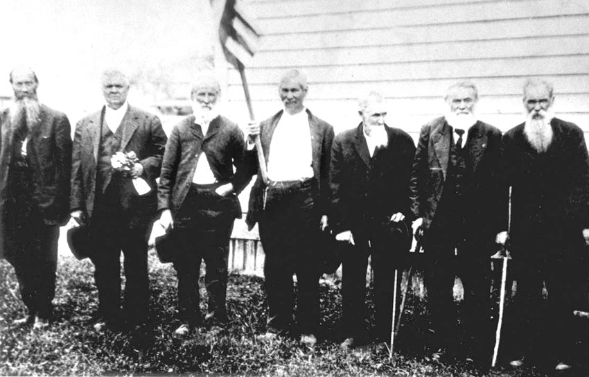 Submitted by Ray Landes  This early 1920s photo shows veterans of the Civil War. Taken in Mossyrock, from left to right, the men are William Young, Si MacFadden, Robert Daniel Silva, Dan Shaner, Robert Amaziah Sparks, Tom Landes and Andrew Jackson Kiser. Silva fought for the South and was in the Battle of Bull Run. Kiser fought for the North with Gen. W.T. Sherman. Both men moved to Ajlune sometime after the war where they became neighbors and friends. From 1893 to 1895, William Young served as the county commissioner from East Lewis County. He had a reputation of holding out for things that would benefit East County residents. Behind his back, William was known by some of the young folk of Mossyrock as &ldquo;Billy Whiskers,&rdquo; because, while driving his Dodge with its top down, his whiskers would divide on each side of his face. We also see Charles Thomas Landes in this photo. Thomas came west and established a homestead on the east side of Mossyrock. He moved west after his father, a storekeeper, was shot and killed. Between having survived the brutal Civil War, and losing his father, Tom had wanted to start anew &mdash; which is what he did. After moving to this area, Tom became a farmer and logger.