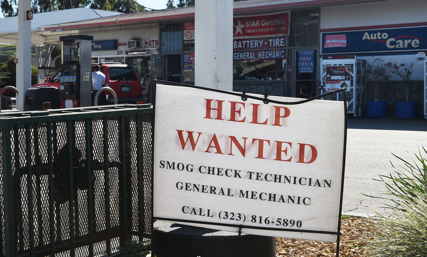 A &quot;Help Wanted&quot; sign for a mechanic and technician is posted in front of a gas station offering auto care services in Montebello, California on Feb. 3, 2022. (Frederic J. Brown/AFP via Getty Images/TNS)