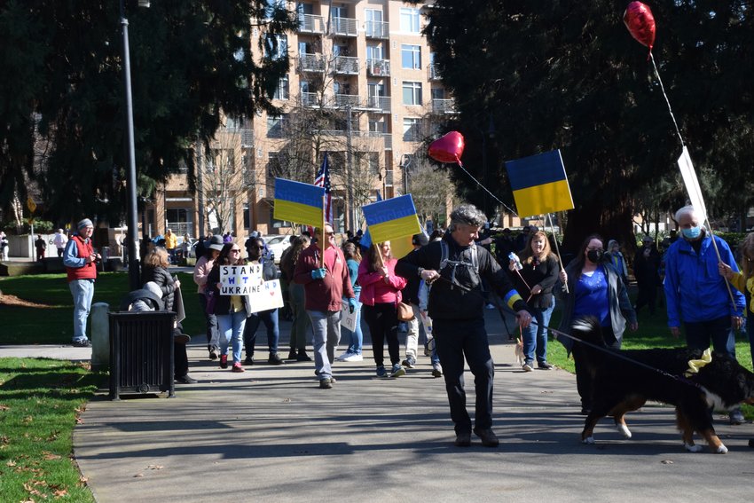 Demonstrators march through Esther Short Park on March 6 in solidarity with Ukraine.