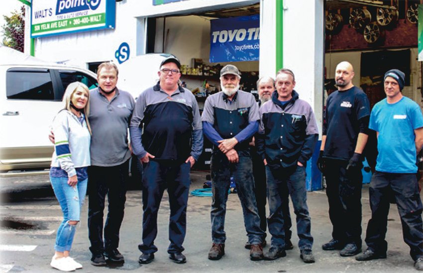 Sherri and Walt Franczyk, left, are pictured with employees of Walt&rsquo;s Point S Tires in this file photo. Walt recently announced his retirement. His daughter Jennifer Palmer and her husband Gilbert will take over ownership of the shop.