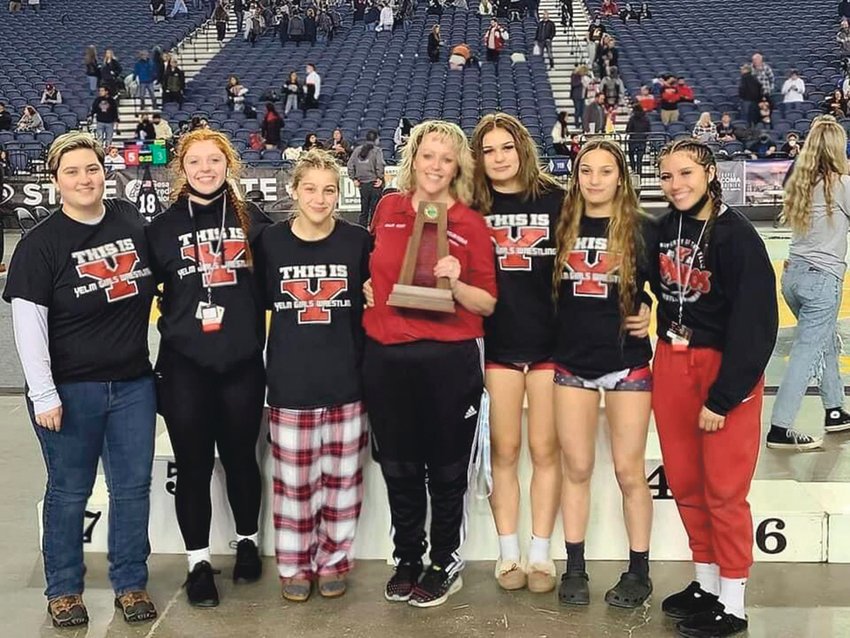 The Yelm girls wrestling team poses for a photo following a fourth place finish at the Mat Classic in Tacoma.