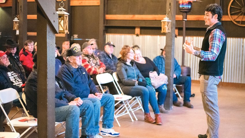 Third Congressional District candidate Joe Kent takes a question from a veteran in the audience during a town hall event in Onalaska in March 2022.