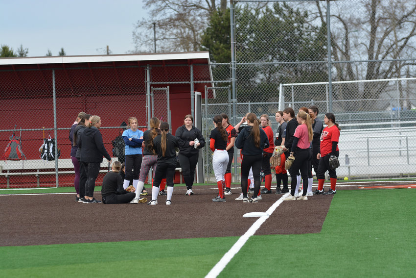 Yelm fastpitch coaches address the team prior to practice.