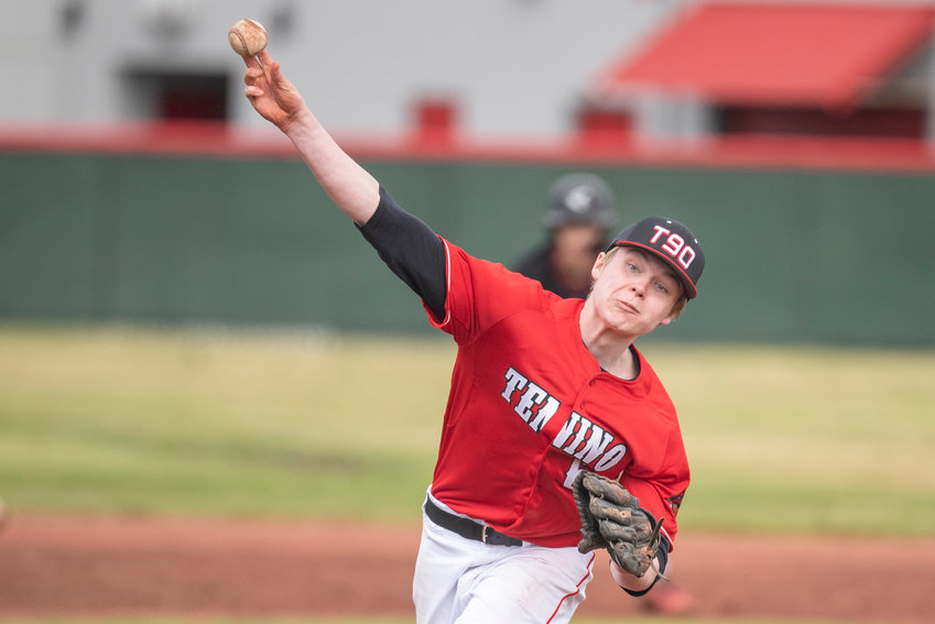 Tenino's Mikey Vassar (6) tosses a pitch to a Toledo batter during a home game on March 16.