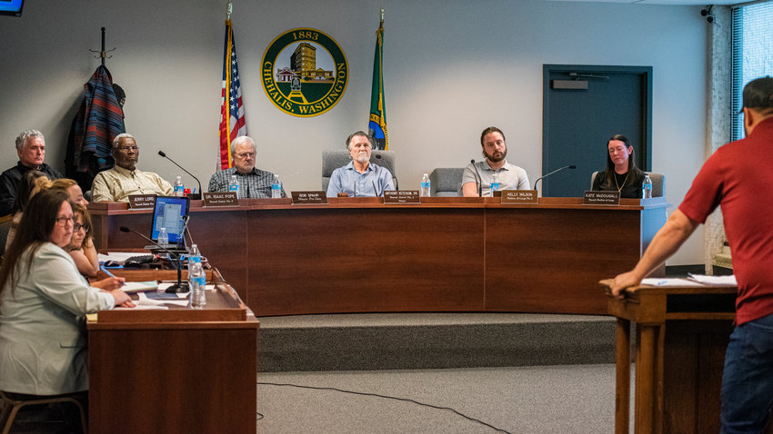 FILE PHOTO &mdash;&nbsp;City council members listen to attendees speak at the podium during a meeting in Chehalis.